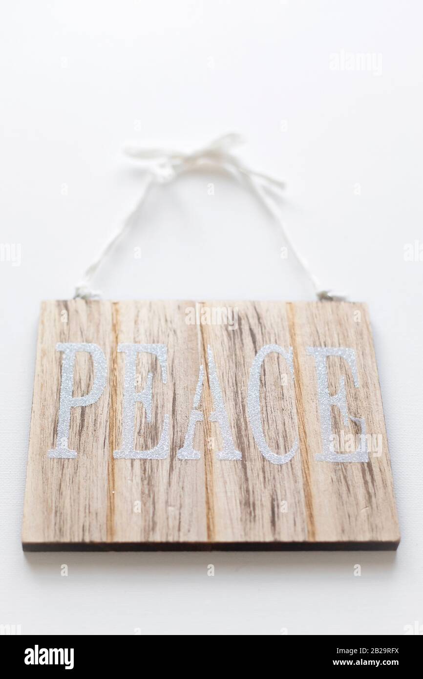 Signe de paix sur fond blanc. Banque D'Images