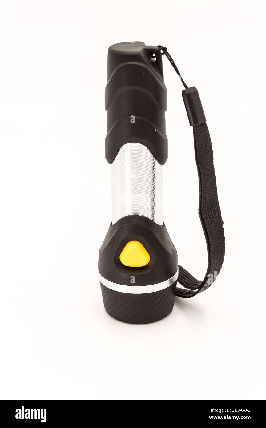 Lampe torche électrique noire avec interrupteur orange isoler sur fond noir Banque D'Images Lampe torche électrique noire avec interrupteur orange isoler sur fond noir Banque D'Images