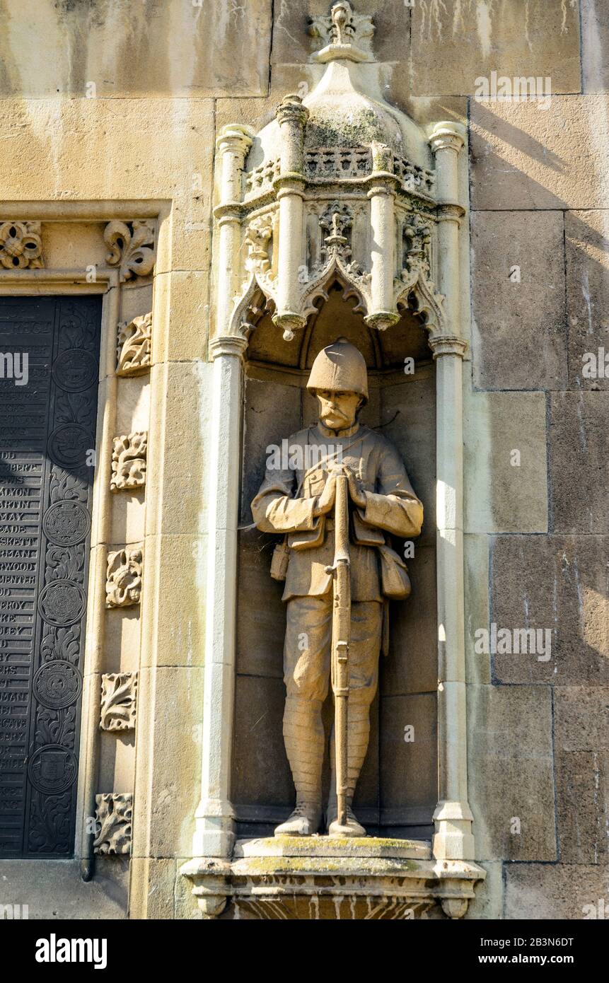 Mémorial du Suffolk Regiment sur le mur extérieur est de St Mary le Grand, église d'Angleterre paroisse Cambridge, Angleterre Banque D'Images