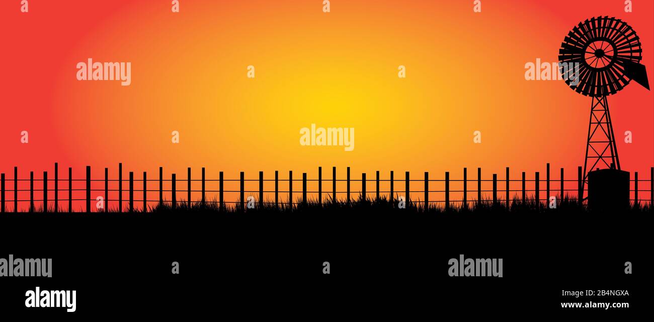Outback Australie avec clôture noire et vieux moulin à vent Banque D'Images