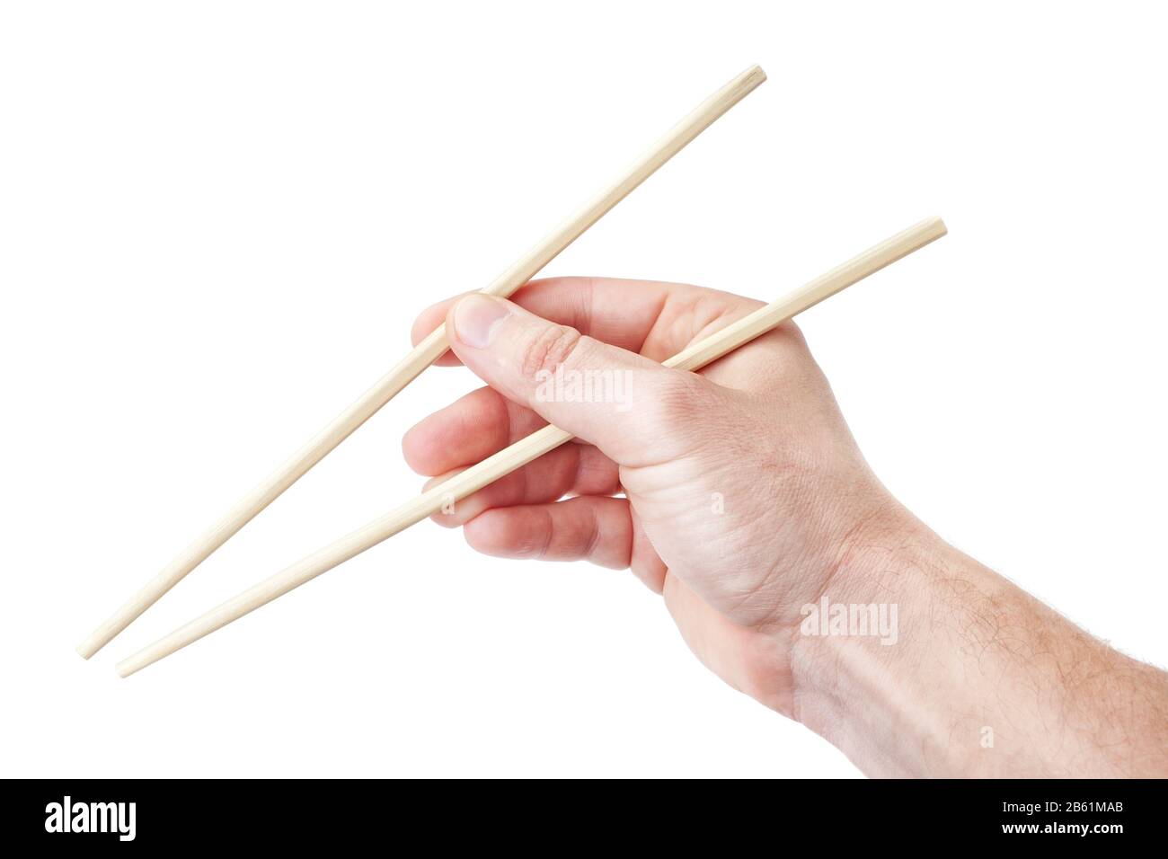 Des baguettes chinoises, dans la main de l'homme pour les sushis. Sur fond blanc. Banque D'Images