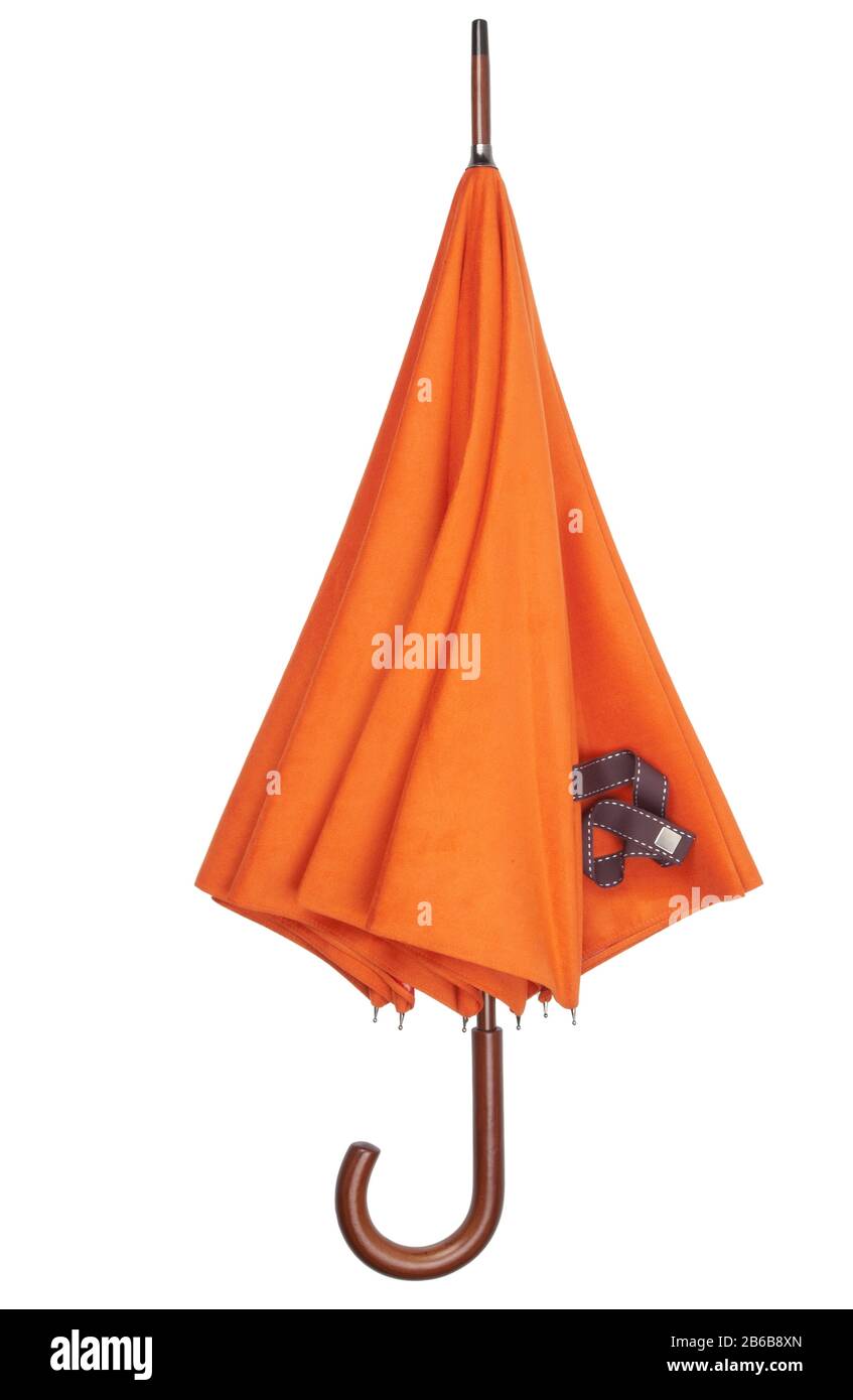Parapluie orange Hermes, en position fermée. Banque D'Images