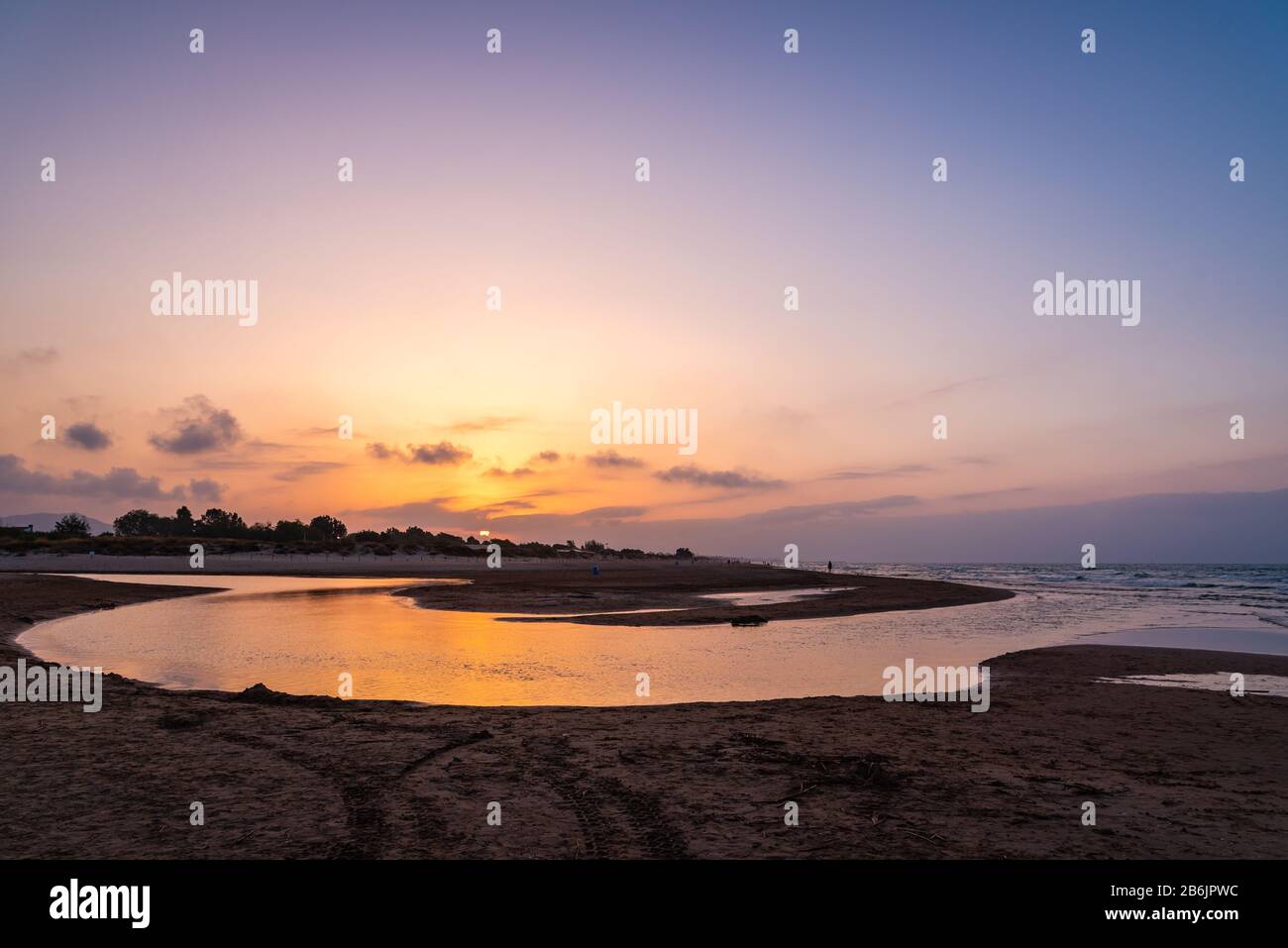 Coucher de soleil sur la plage en mer Méditerranée, Oliva, Valence Banque D'Images