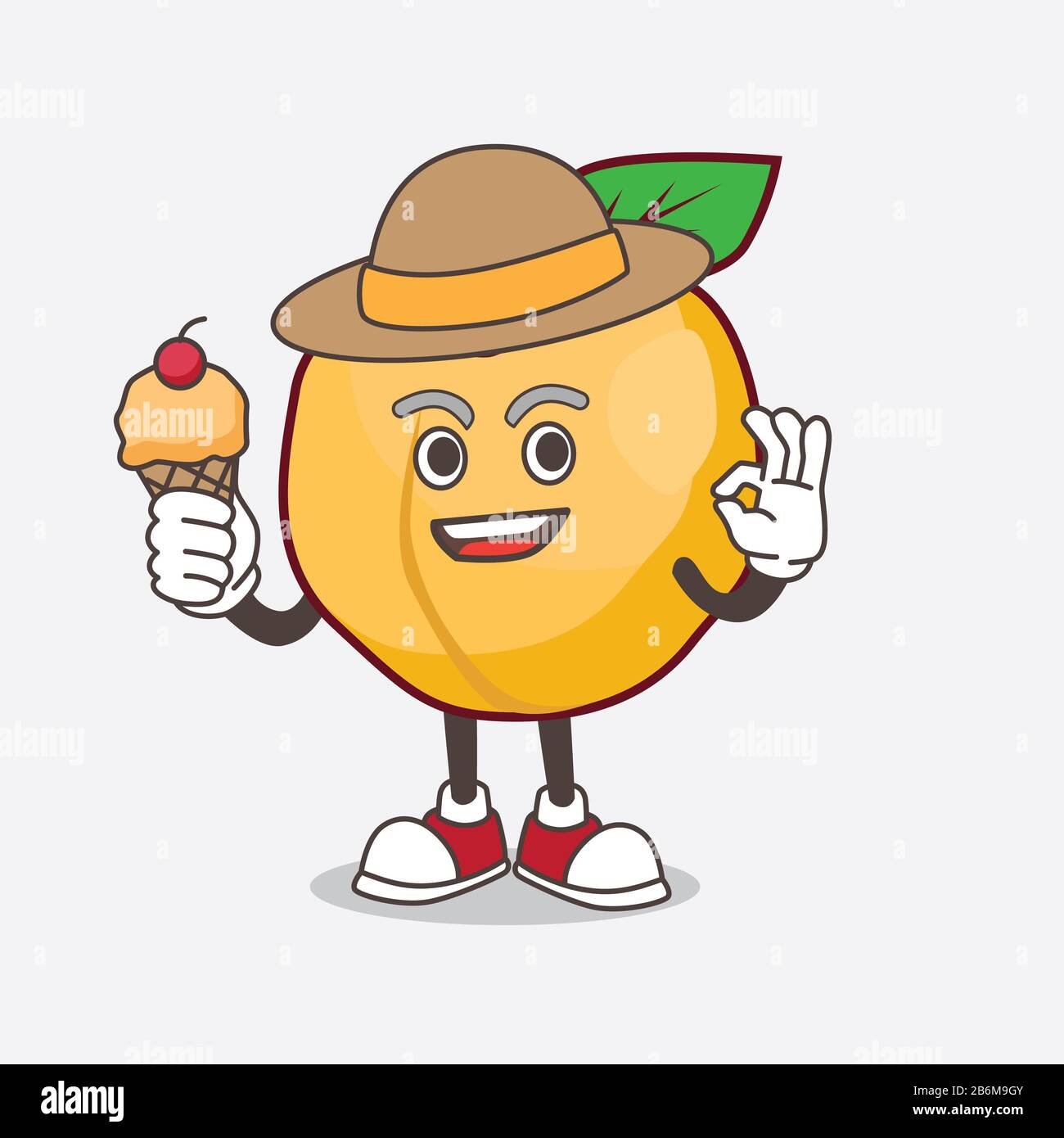 Une photo du personnage de mascotte de caricature d'Apricot contenant de la glace Banque D'Images