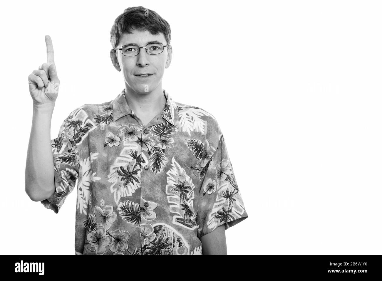 Portrait d'homme pointant doigt vers le haut Banque D'Images