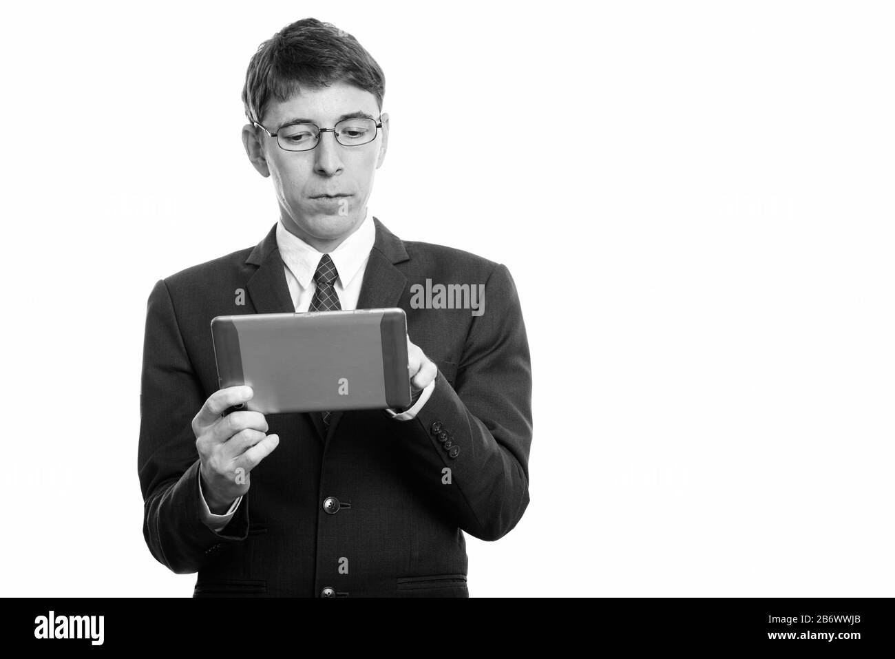 Studio shot of businessman using digital tablet Banque D'Images