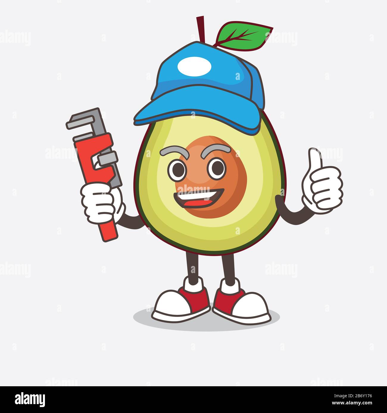 Une illustration du personnage de mascotte de dessin animé de fruits d'avocat comme un plombier heureux Banque D'Images
