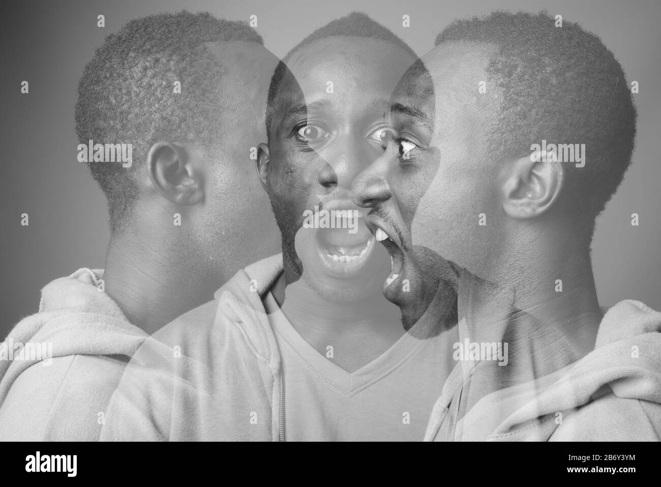 Portrait de jeune homme africain contre l'arrière-plan gris Banque D'Images