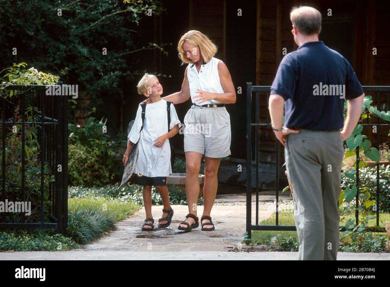 Austin Texas USA, 1997: Papa non gardien prend l'enfant de maman pour une visite de week-end. M. ©Bob Daemmrich Banque D'Images