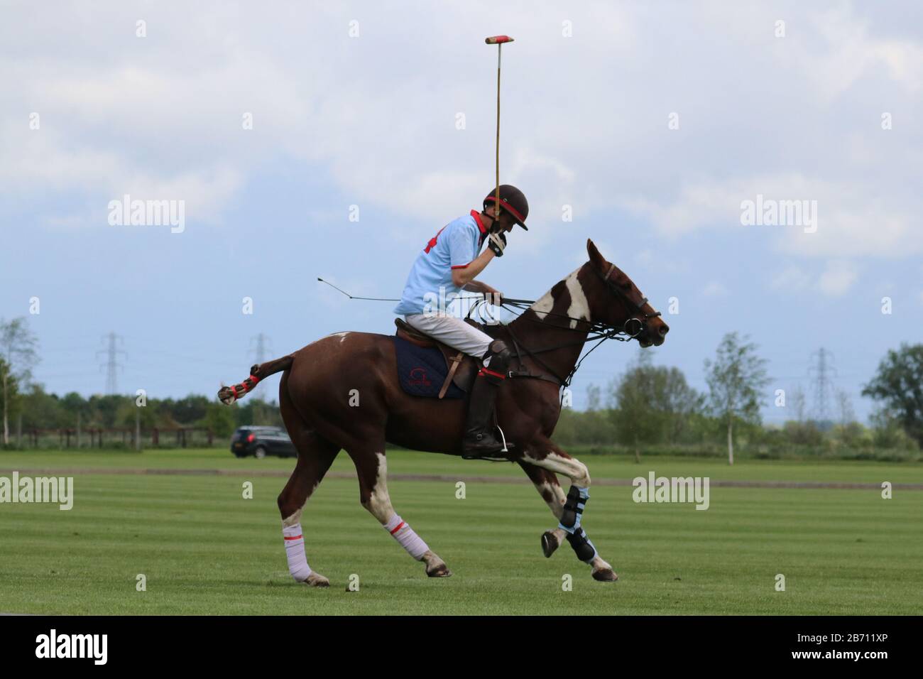 Le joueur de Polo tente de prendre une photo en main Banque D'Images