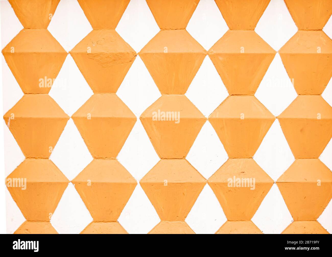 Texture du mur peint avec des rhombus en deux couleurs. Banque D'Images