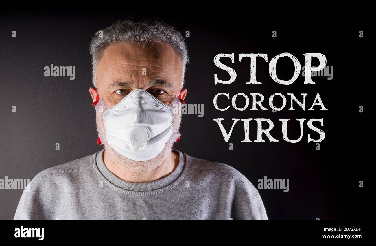 Arrêter le virus corona. Homme avec masque pour se protéger de l'infection de Covid-19. Protection respiratoire. Banque D'Images