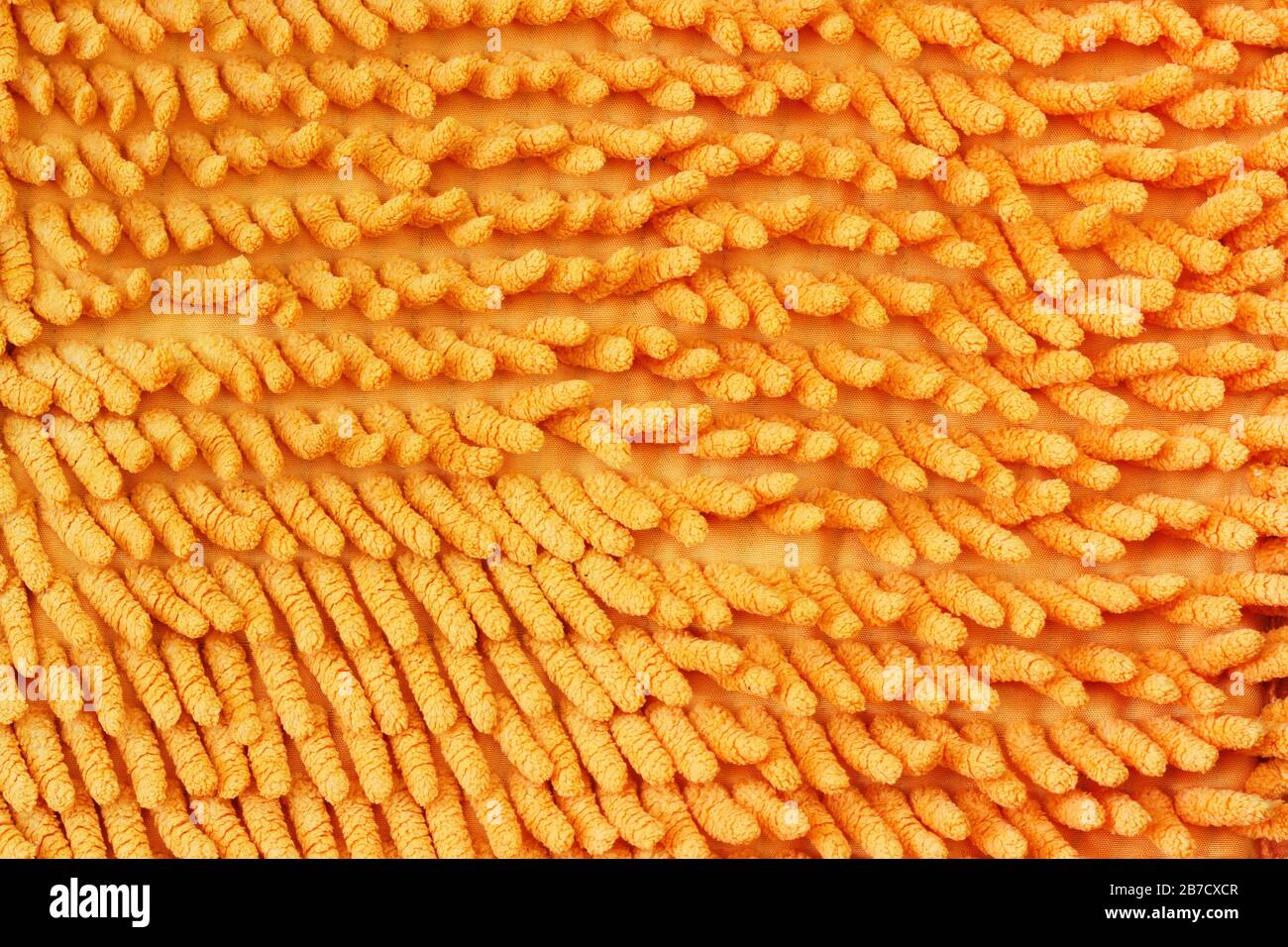 Texture de tissu avec une grande pile de gros plan de couleur orange. Banque D'Images