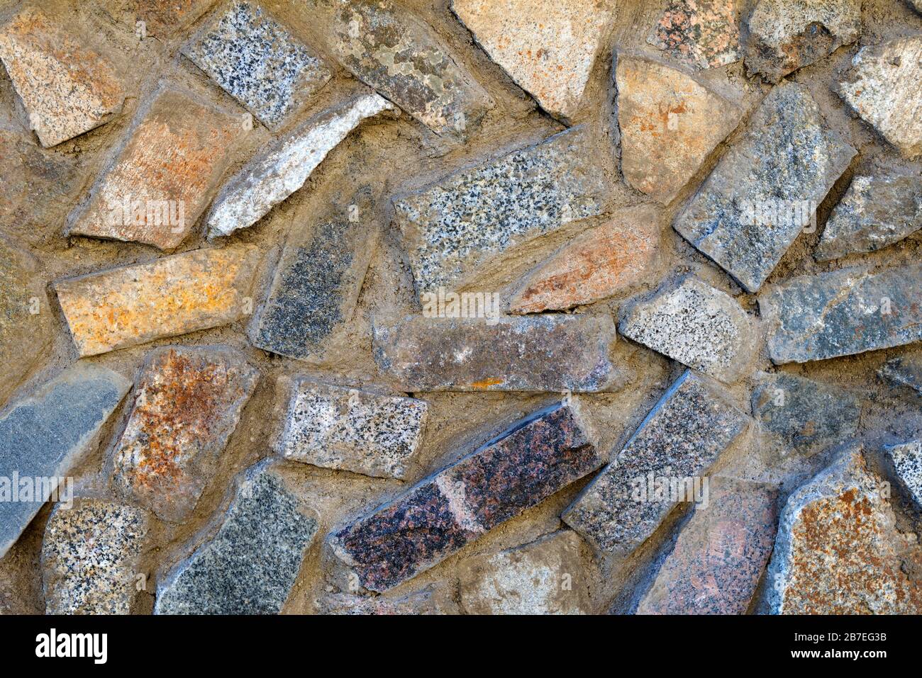 Texture de pierres de différentes couleurs, briques et béton Banque D'Images