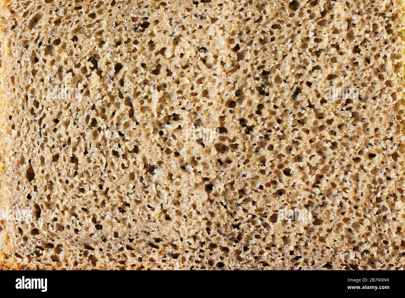 Texture poreuse du pain cuit à partir d'un mélange de farine de seigle et de blé. Banque D'Images