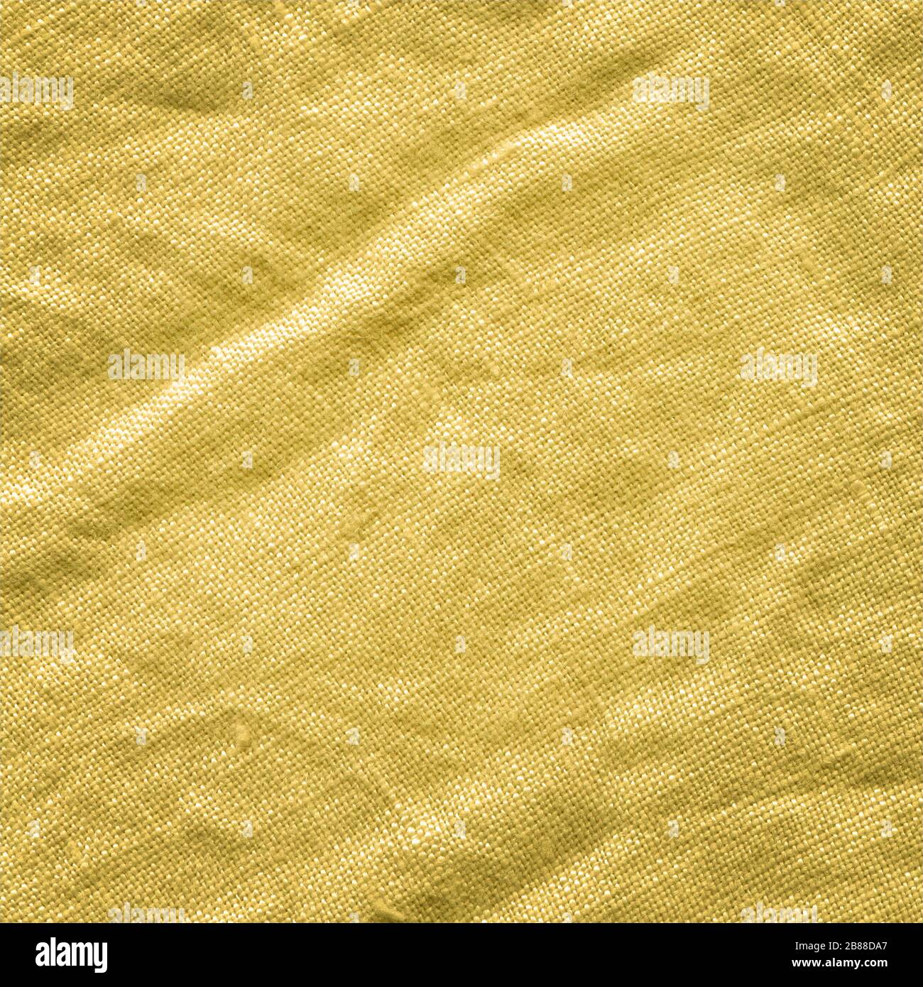 Texture de tissu moutarde pour le fond. Tissu en tissu jaune moutarde. Arrière-plan de texture de tissu Banque D'Images