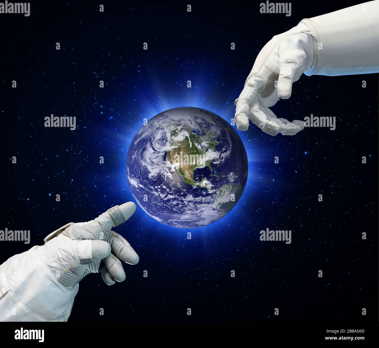 Astronaute et main robotisée en contact. Éléments de cette image fournie par la NASA. Banque D'Images