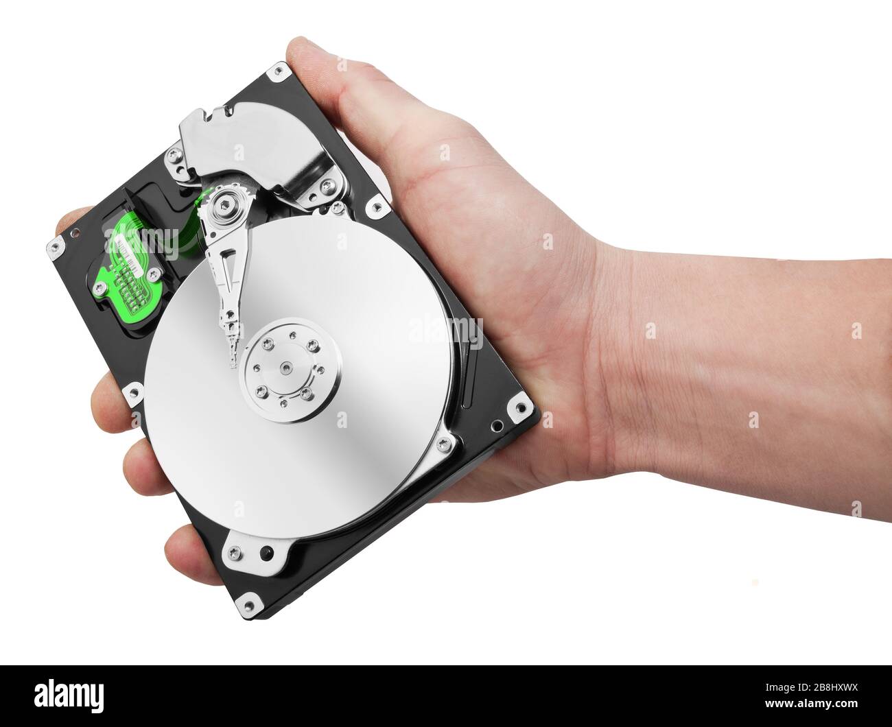 Disque dur manuel et ordinateur isolé sur fond blanc Banque D'Images