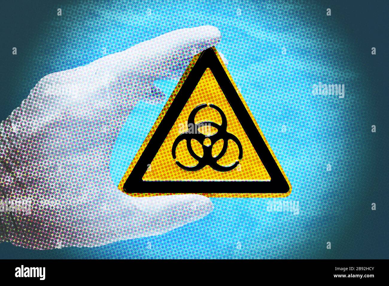 Biologie signe de danger est tenu par une main dans le gant de latex, la photo symbolique Coronavirus, Biogefährdungsschild wid von einer main im Latexhandschuh gehal Banque D'Images