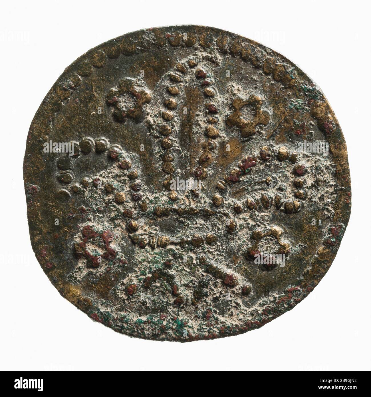 Jeton de compte au lys attribué aux ecclésiastiques de l'hôtel King's, Anonyme du XIVe siècle. 'Jeton de compte à la fleur de lys attribué aux clercs de l'Hôtel du roi, XIVe siècle'. Cuivre. 1300-1325. Paris, musée Carnavalet. Banque D'Images