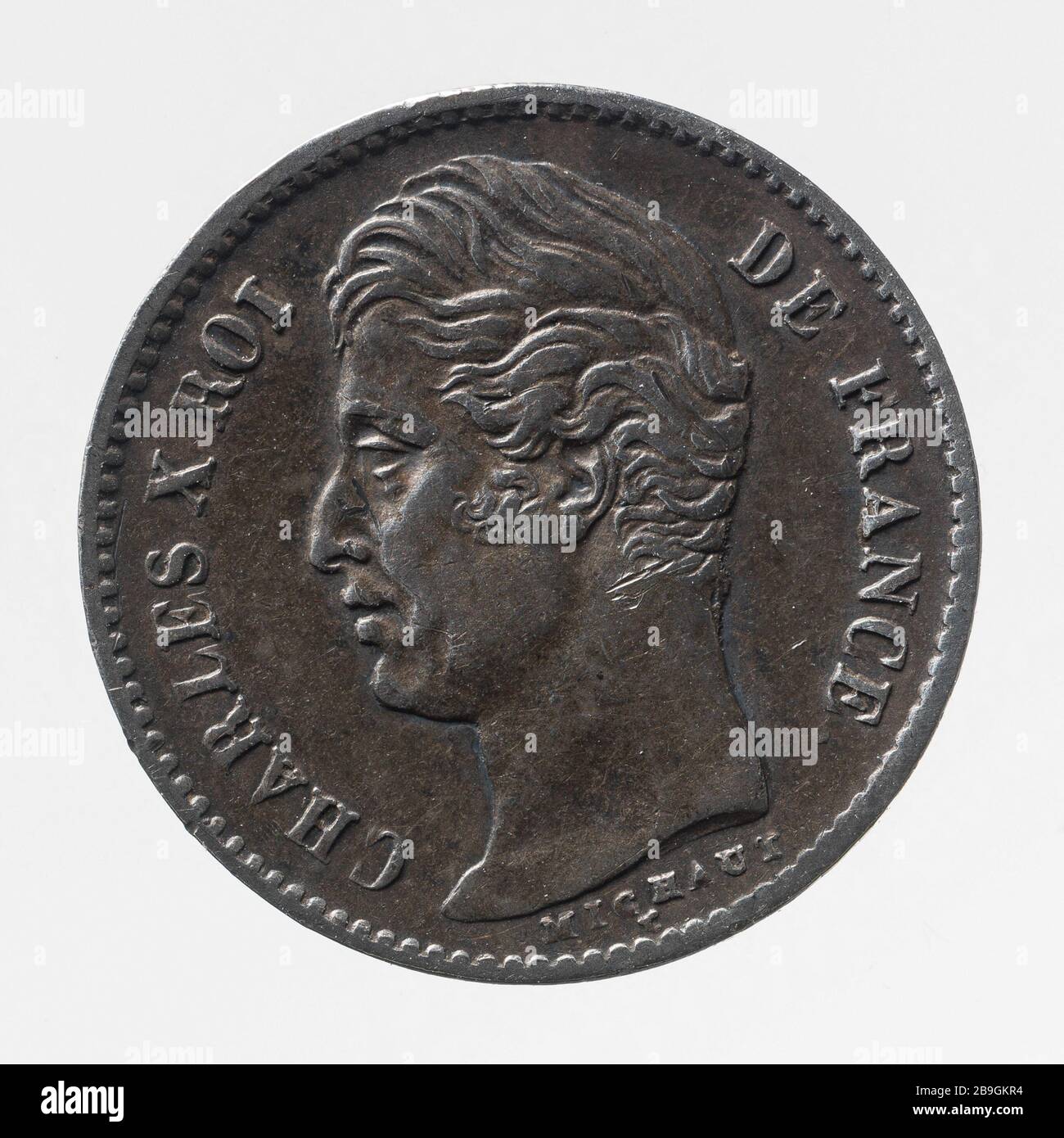 Pièce 1/4 Franc Charles X en 1828 Auguste François Michaut. Pièce de 1/4 de franc de Charles X, 1828. Argent, 1828 Paris, musée Carnavalet. Banque D'Images