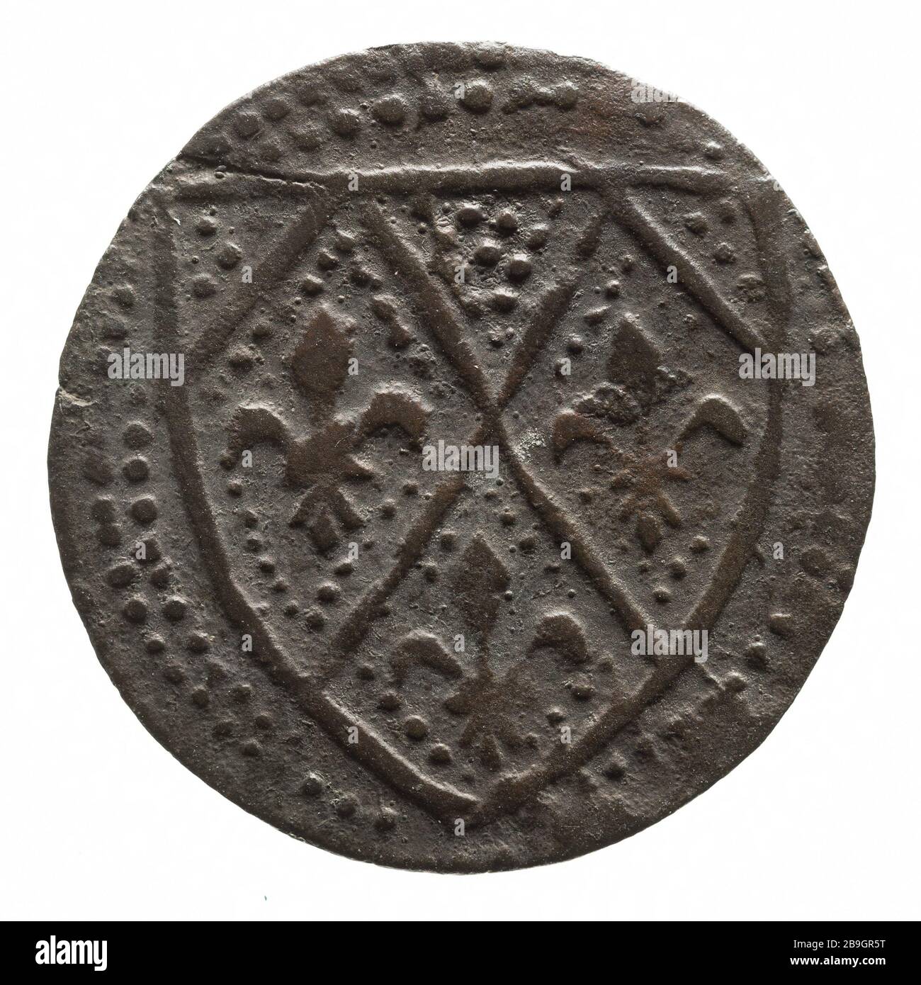 Témoignage symbolique d'une famille noble française, Anonyme du XIV siècle. 'Jeton de compte d'une famille noble française, XIVe siècle'. Cuivre. Paris, musée Carnavalet. Banque D'Images