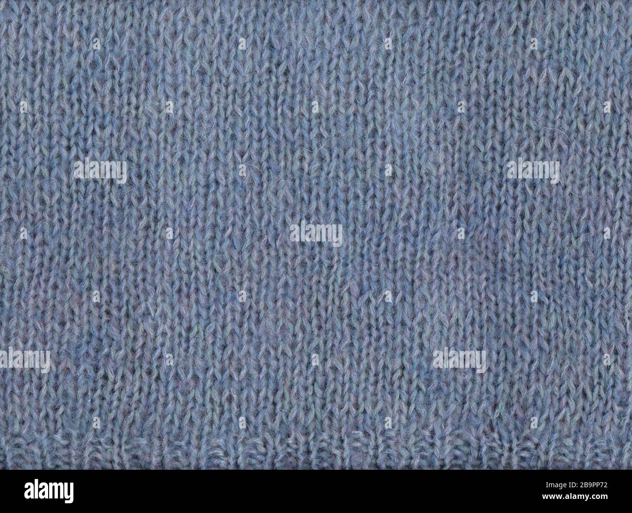 Pull en laine. Texture du tissu tricoté. Arrière-plan par temps froid. Banque D'Images