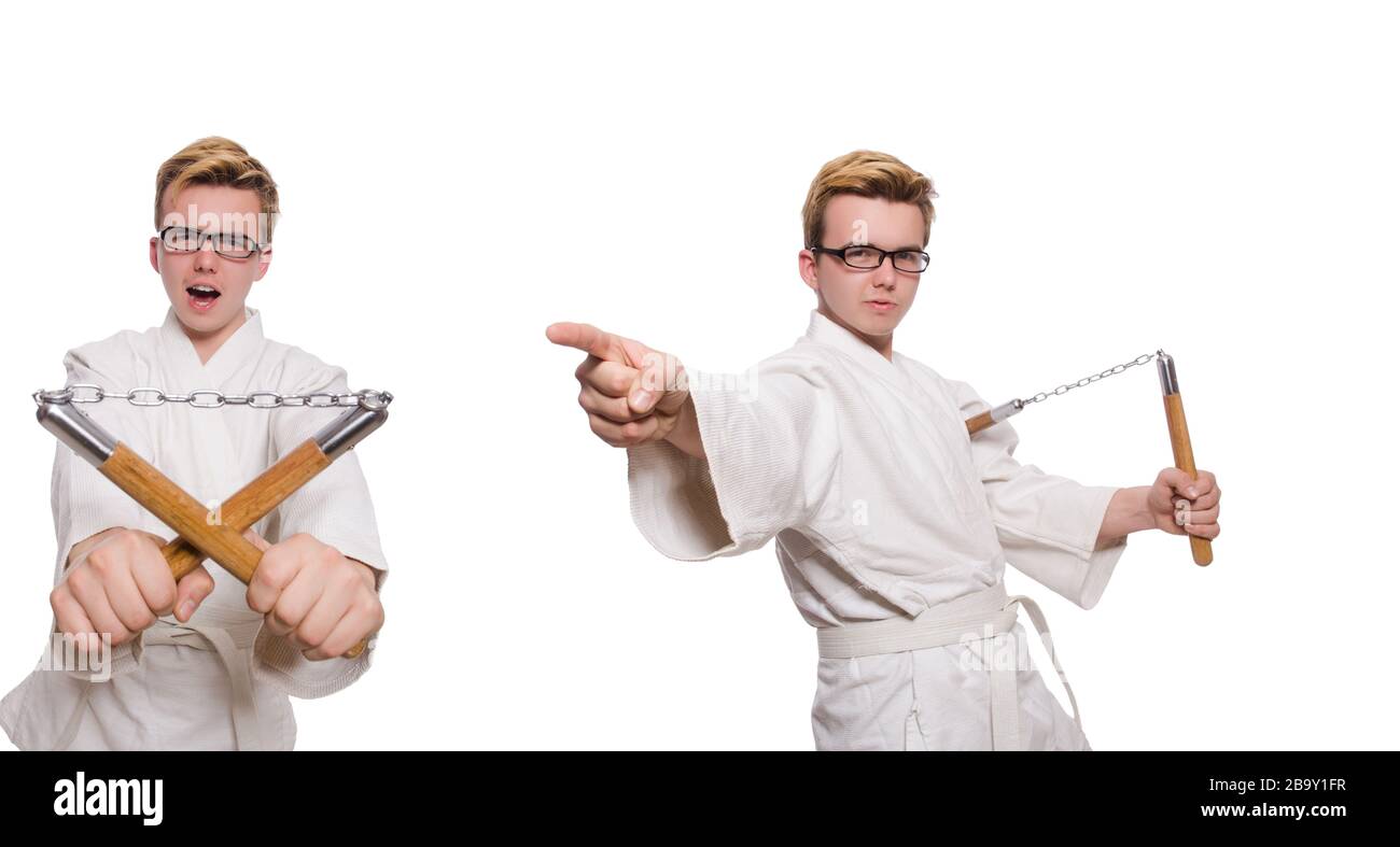 Le funny karate fighter avec nunchucks on white Banque D'Images