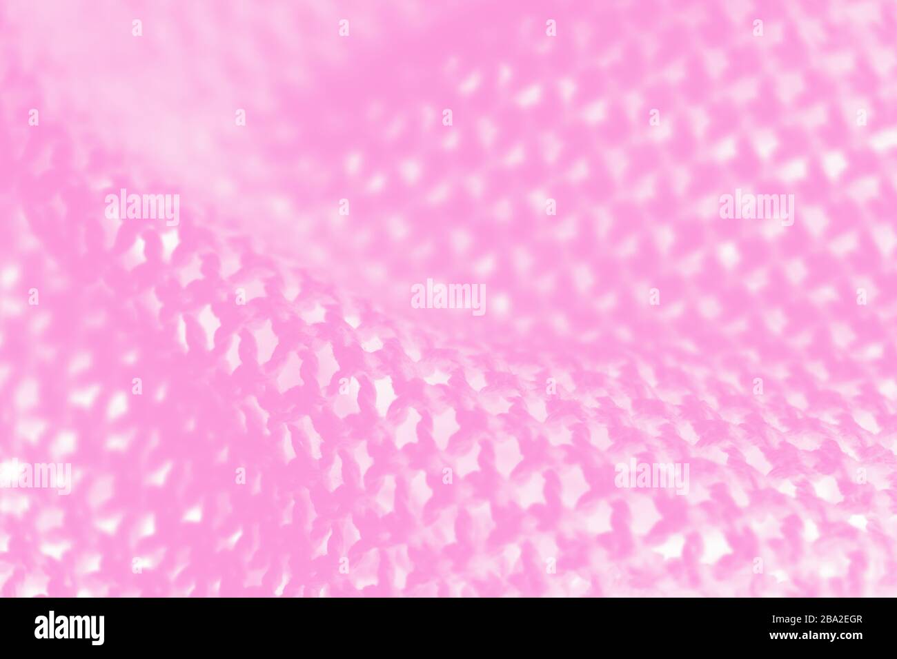 Toile de fond en mesh rose, texture d'arrière-plan triquée Banque D'Images