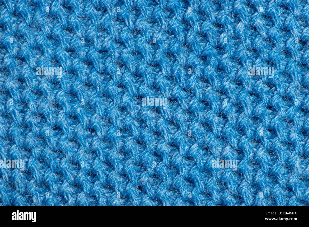 Tissu tricoté bleu texture de fond pour le design, couleur tendance bleu classique. Banque D'Images