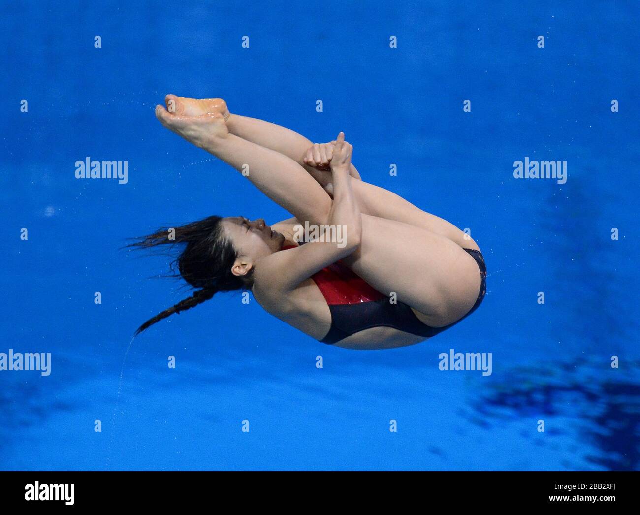 L'HE ZI de la Chine en action lors de la finale du Springboard de 3 m pour les femmes au Centre aquatique Banque D'Images