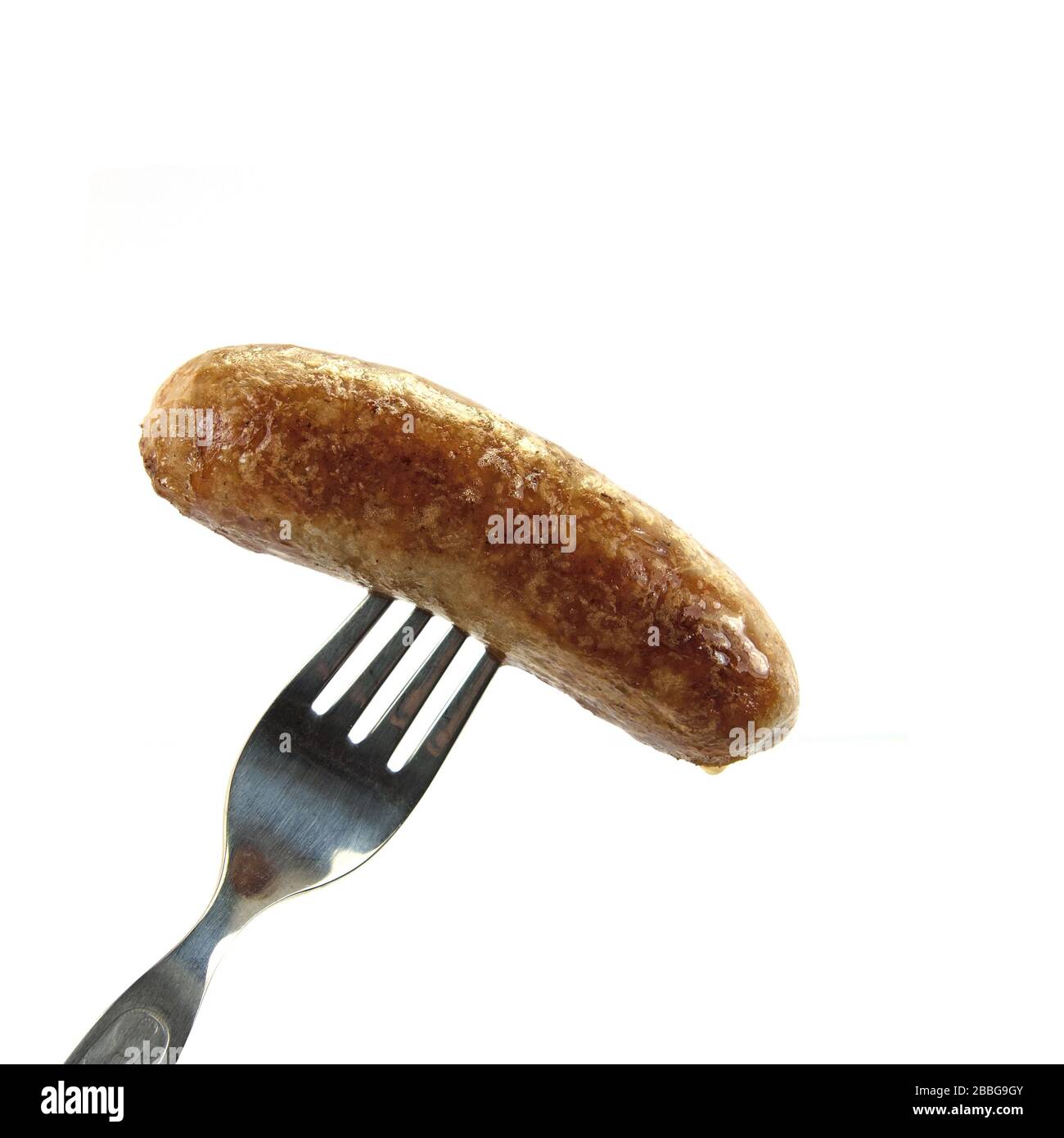La saucisse frite est brossée sur une fourchette Banque D'Images