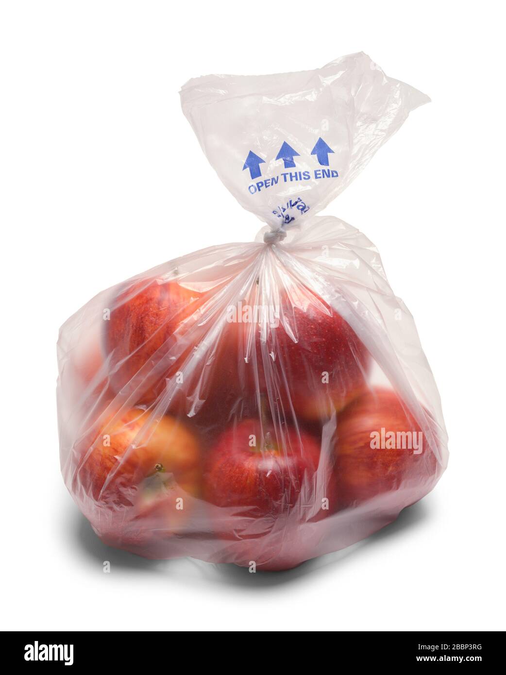Petit sac d'pommes en plastique isolé sur blanc. Banque D'Images