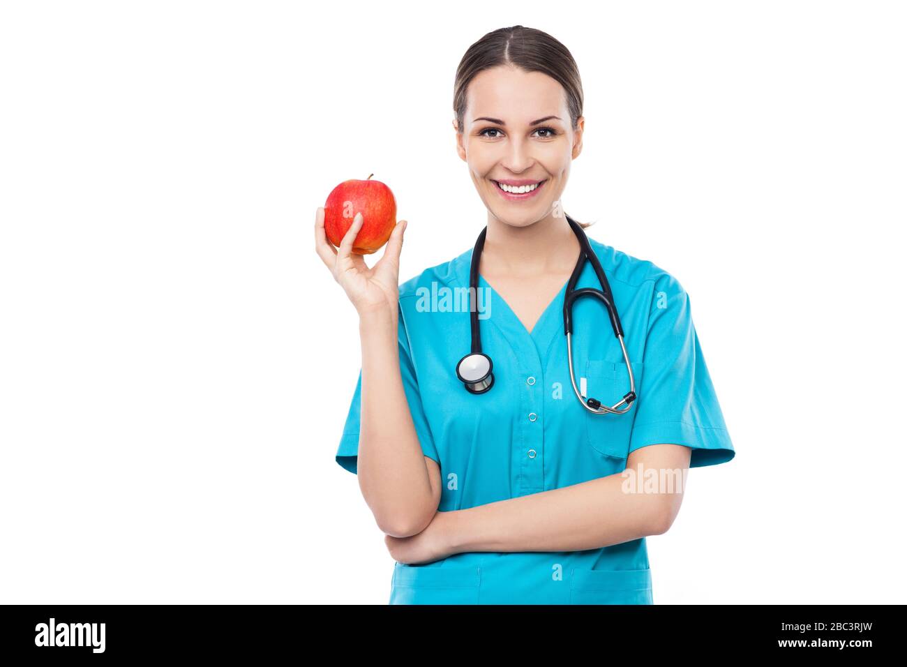 Femme médecin tenant une pomme Banque D'Images