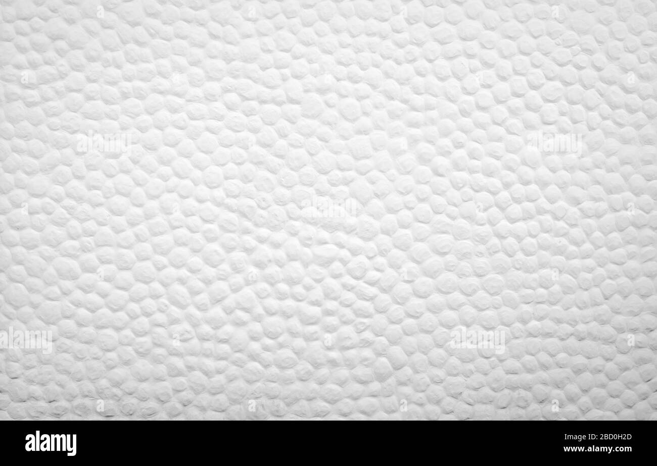 Décoration d'arrière-plan en béton blanc avec petit point rond convexe. Mur de ciment blanc du bâtiment. Arrière-plan artistique. Décoration extérieure ou intérieure Banque D'Images