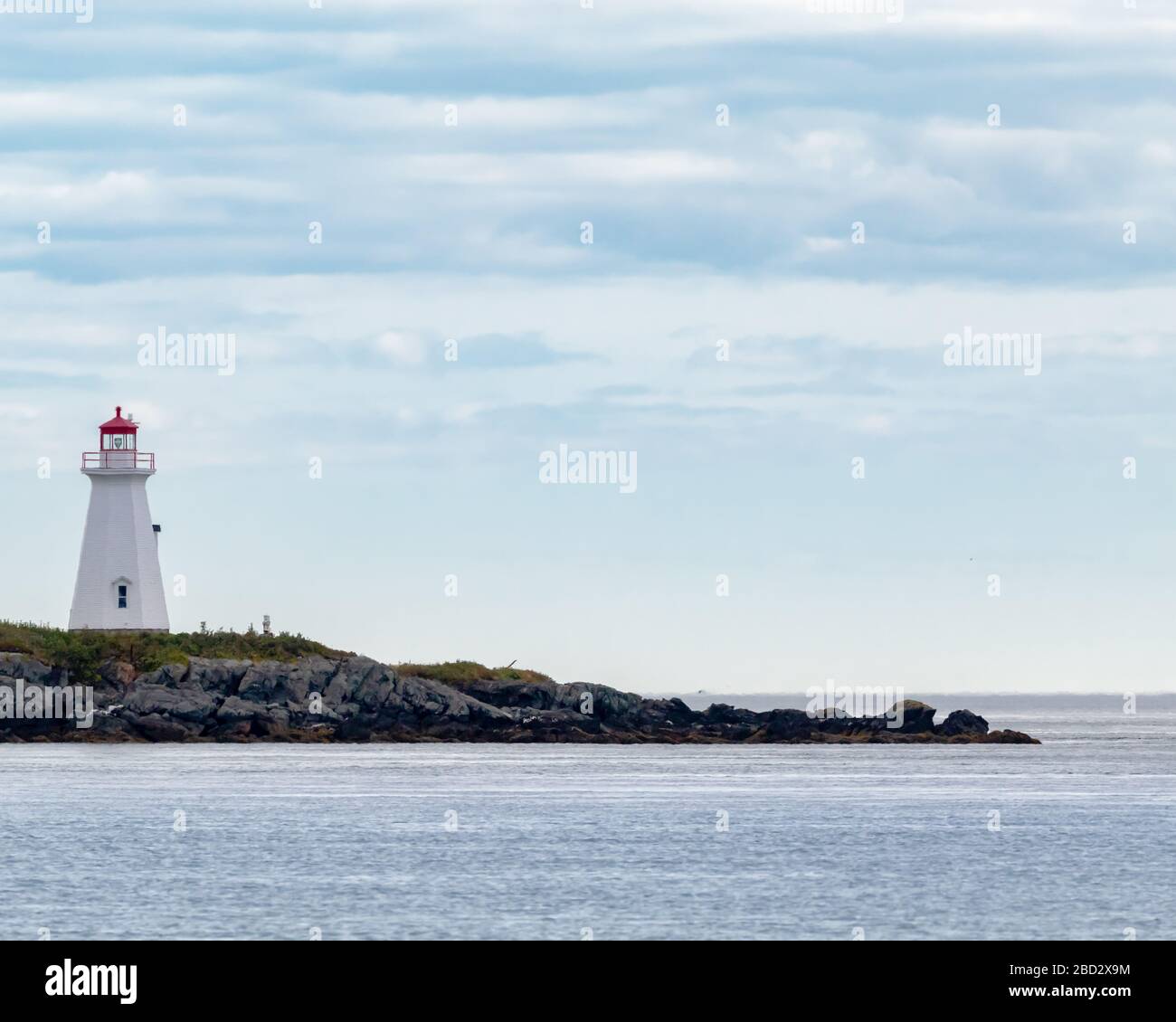 Phare de l'Etete point - vu du ferry allant à Deer Island. Banque D'Images
