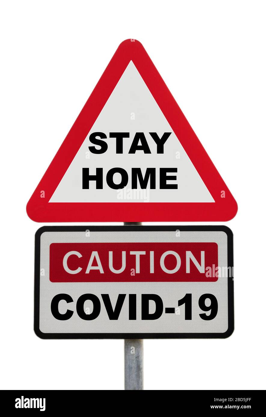 Avertissement de signe triangulaire attention COVID-19 avec les mots RESTER À LA MAISON message pour illustrer le nouveau concept de règles de verrouillage du coronavirus. Pays de Galles Banque D'Images