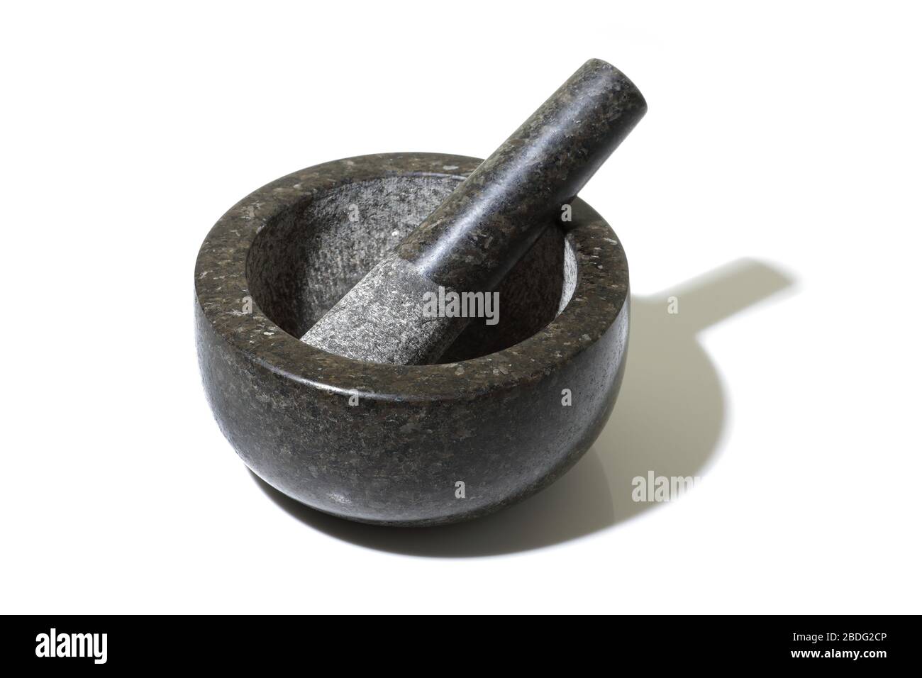 Un mortier et pilon sur blanc avec ombre Banque D'Images
