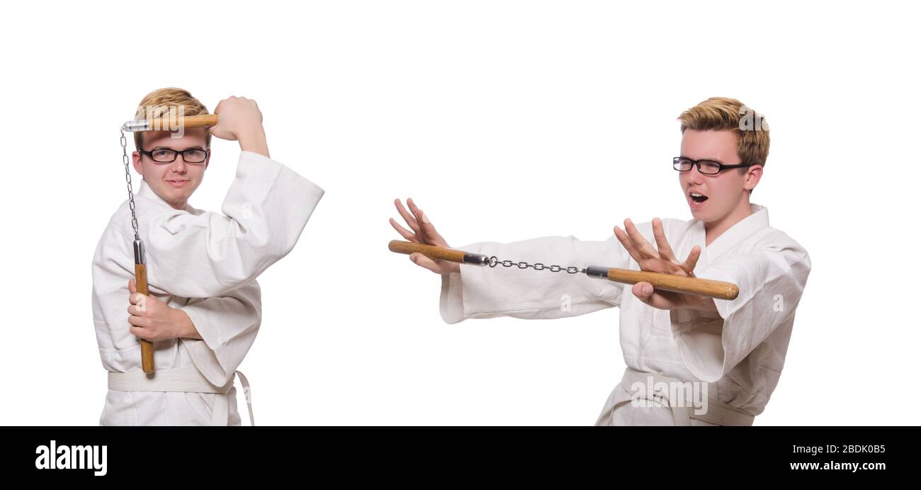 Le funny karate fighter avec nunchucks on white Banque D'Images