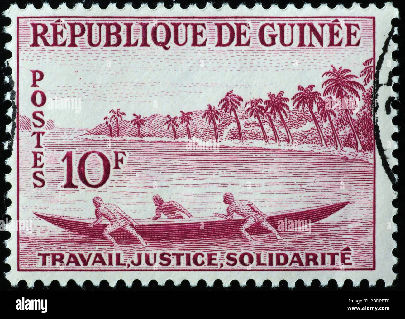 Pêcheurs africains sur l'ancien timbre-poste de la Guinée Banque D'Images
