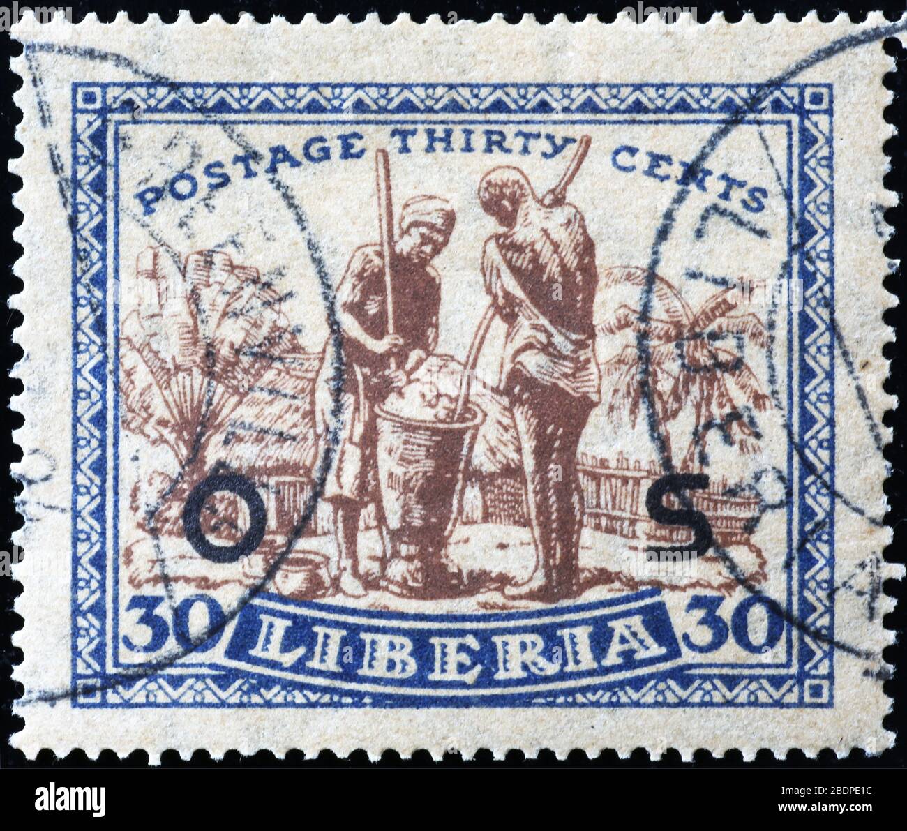 Personnes au travail sur l'ancien timbre du Libéria Banque D'Images