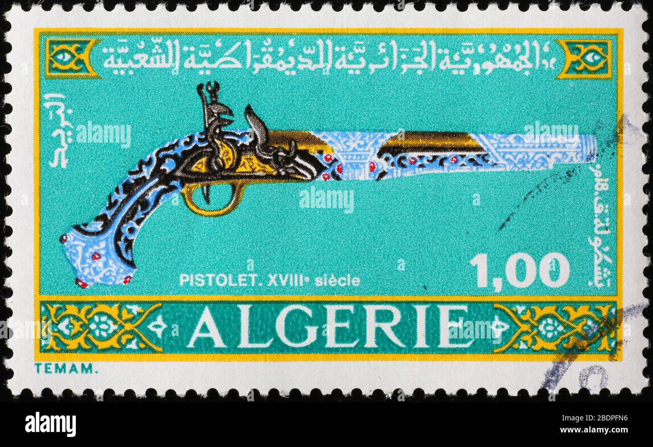 Pistolet ancien sur timbre-poste algérien Banque D'Images