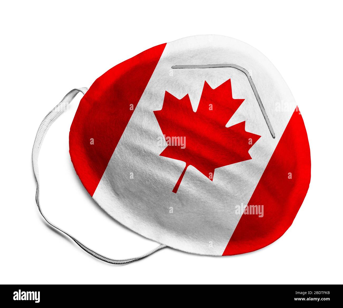 Masque médical N-95 avec drapeau canadien isolé sur fond blanc. Banque D'Images