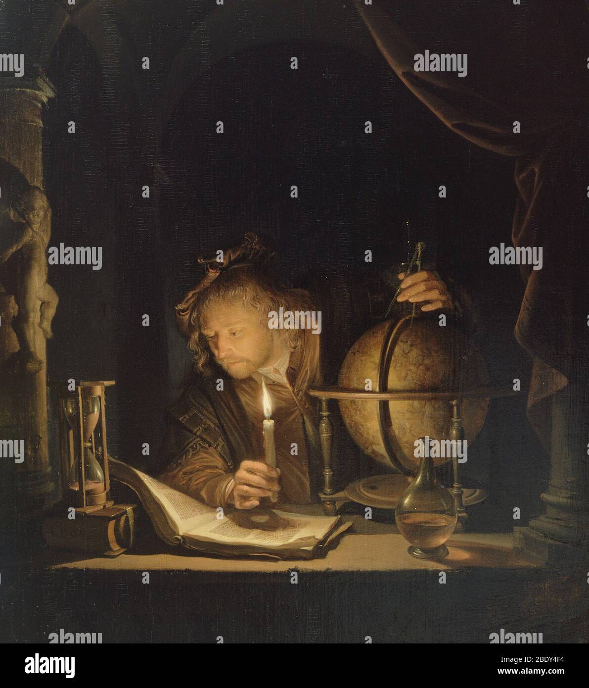 Astronome par Candlelight, c.c. Banque D'Images