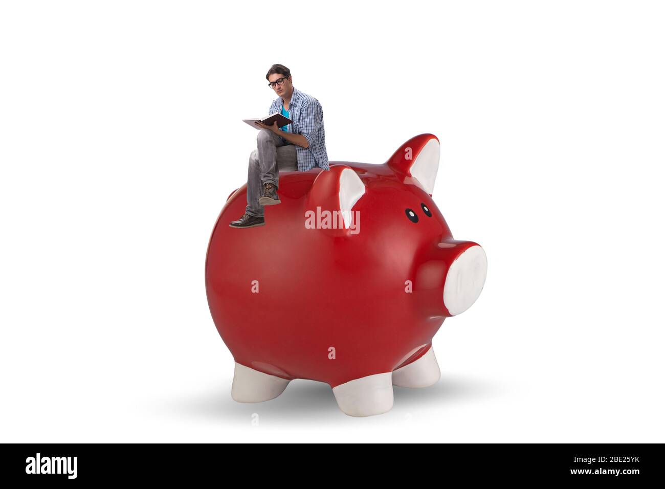 Le concept de la dette des étudiants avec la piggybank et l'étudiant Banque D'Images