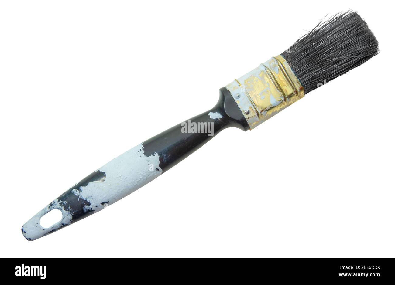 Une brosse de peinture ancienne Grungy recouverte de peinture blanche Banque D'Images