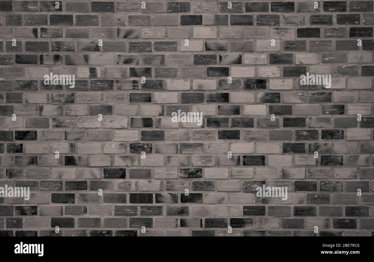 Fond de texture de mur de brique sombre. Vieux papier peint vintage. Architecture de bâtiment intérieur en briques Grunge. Texture de mur de briques rugueuses. Lissage Banque D'Images