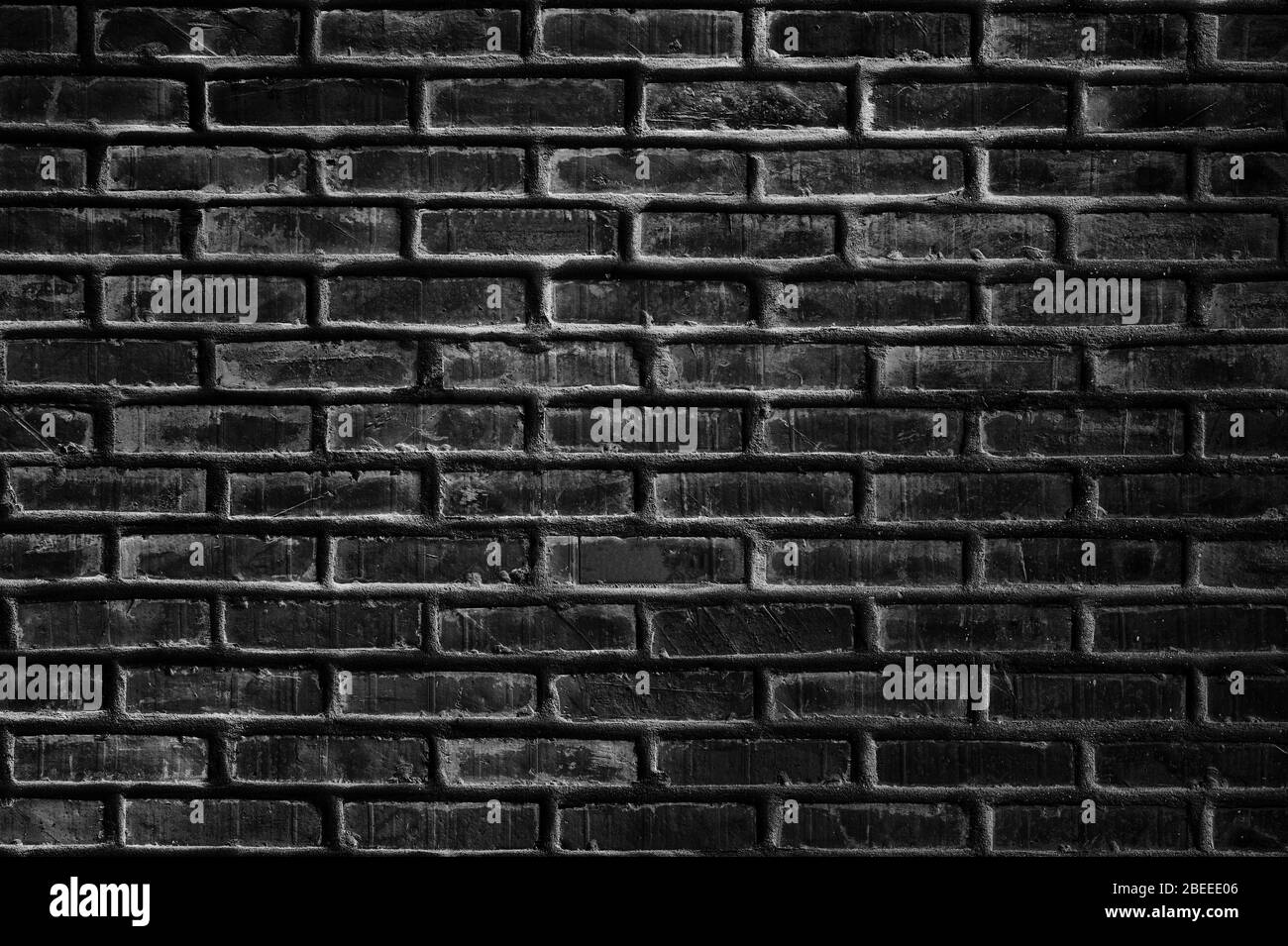 Fond de texture empilé de mur de briques noires Grungry Banque D'Images