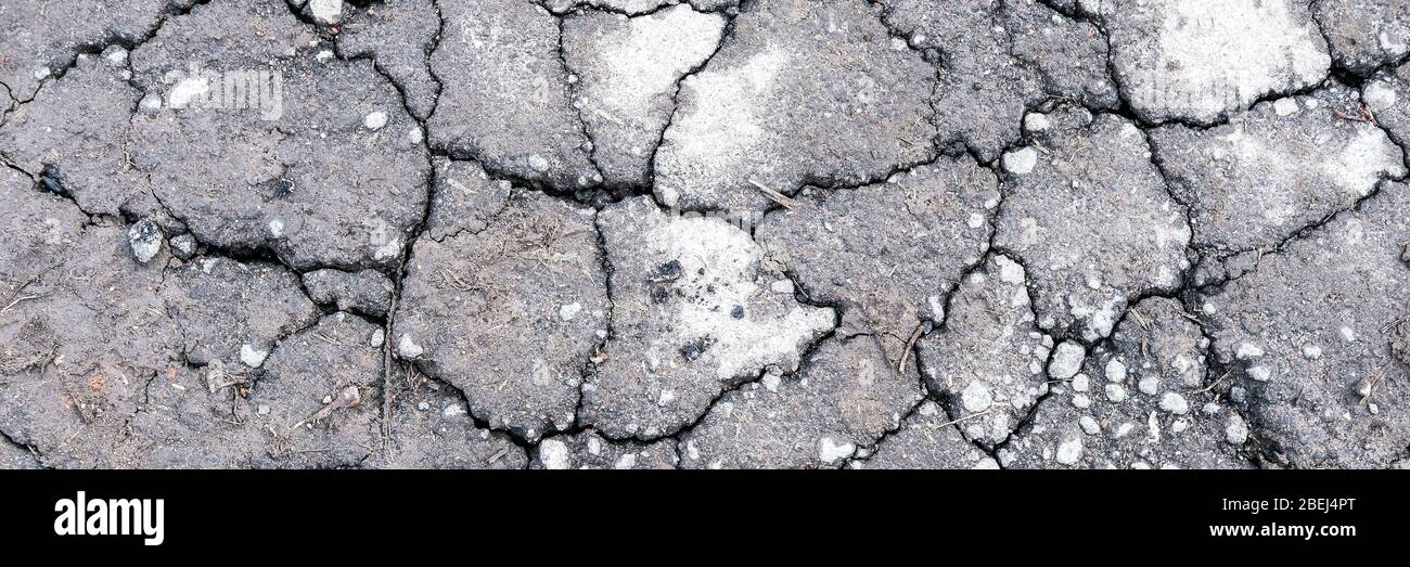 Planète sans eau. Masse craquée gris sec. Climat chaud et concept de sécheresse. Fond désert Banque D'Images