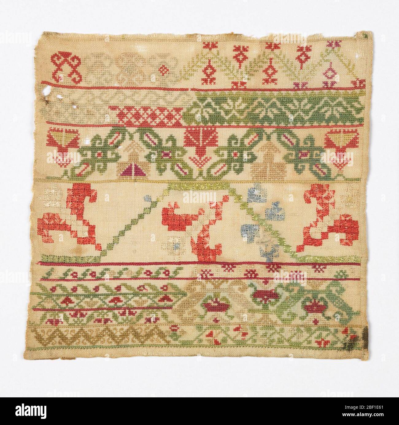 Échantillonneur vintage brodé à la main. Broderie encadrée